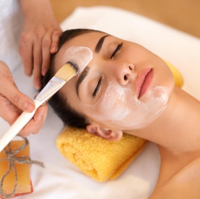 Dermatologist treat acne at female face